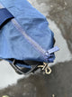 Close up of zipper of navy tote bag