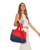 girl holding red bag at side