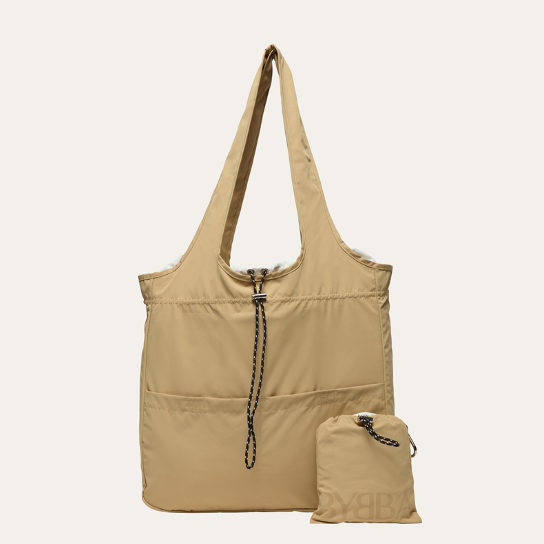 Beige tote bag with a smaller matching pouch on a white background