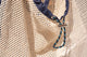 close up of drawstring of net bag