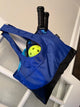 Blue pickle ball bag filled with paddle and balls