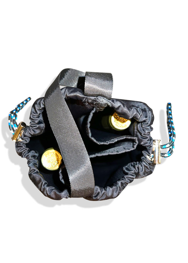 Top view of open pouch of black bag; each section containing a bottle