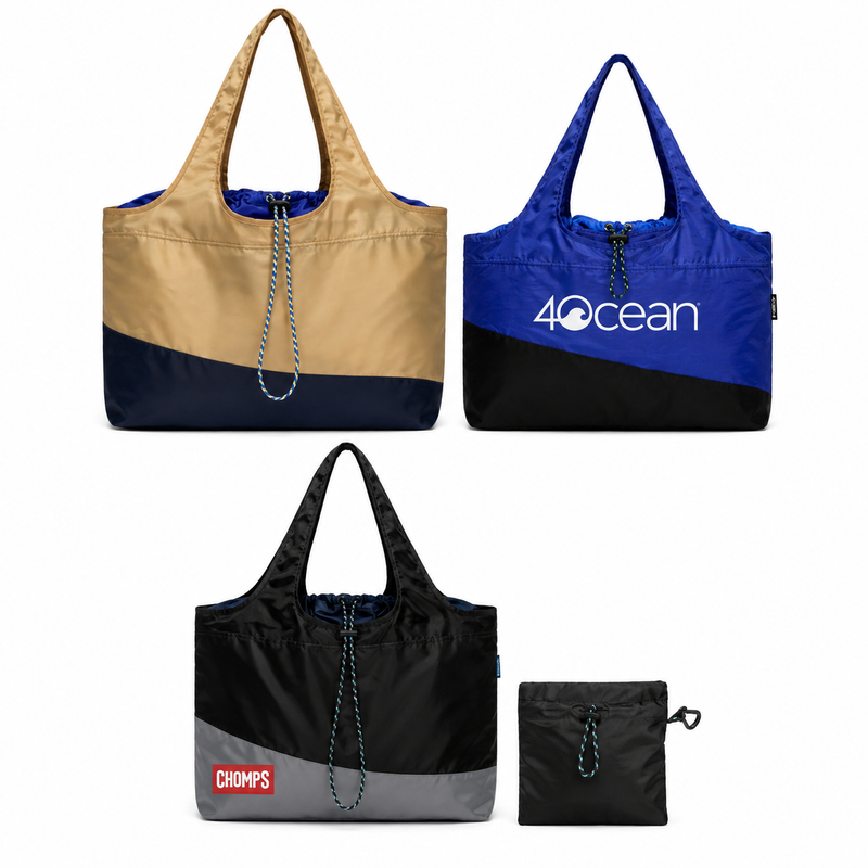 BYBBA tote bags in tan, blue, and black, featuring color-blocked designs, drawstring closures, and coordinating pouches, including 4Ocean and CHOMPS branding.