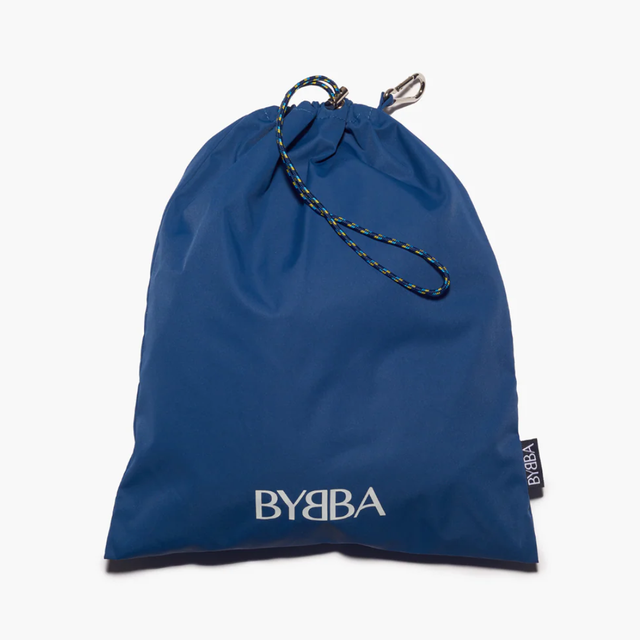 Blue packable, foldable, reusable bag made from recycled ocean plastic by BYBBA with drawstring closure