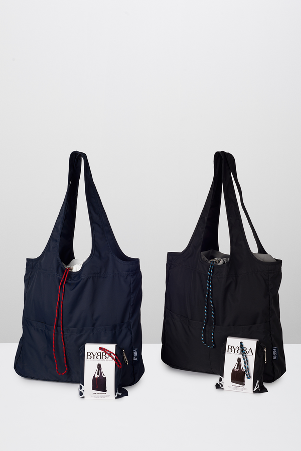 Navy tote bag next to a black tote bag