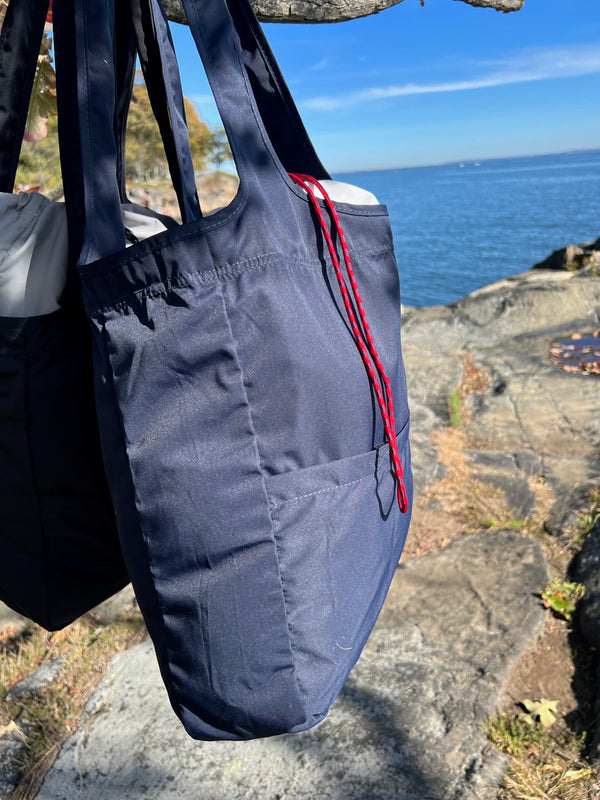 Navy blue tote bag outdoors