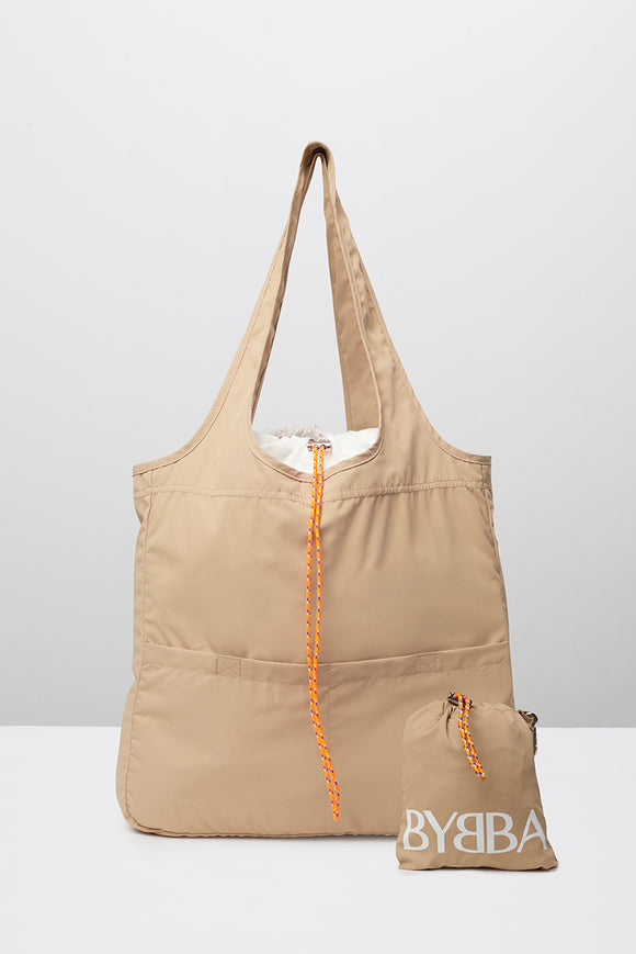Tan tote bag with enclosed carry pouch